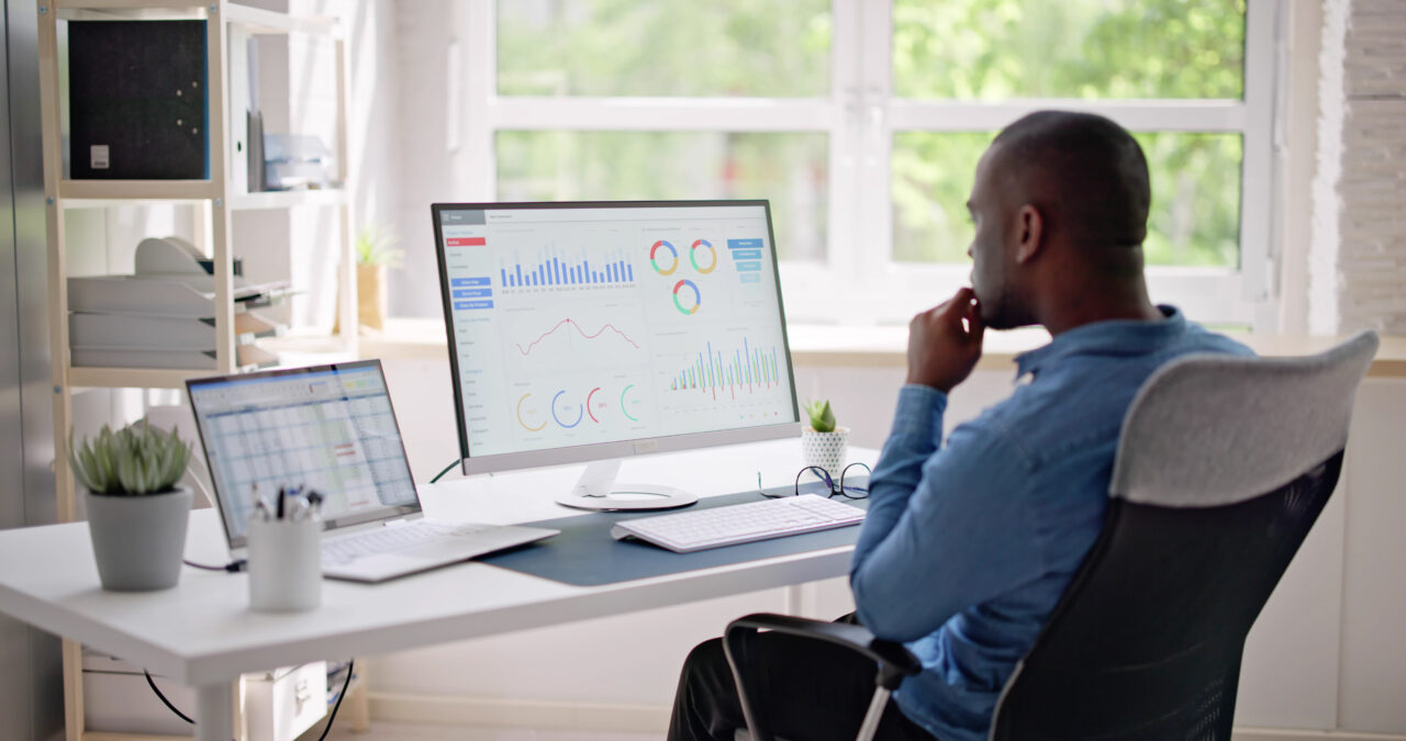 Businessman Using Analytics Data KPI Dashboard