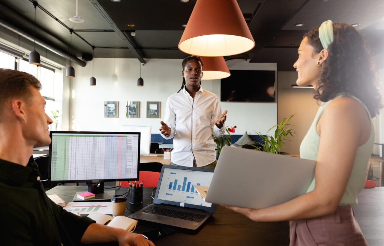 Team meeting discussing email marketing strategy